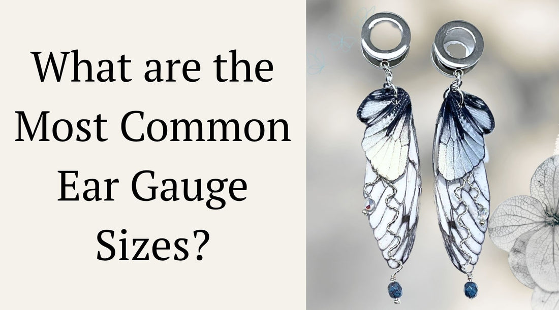 Silver fairy wing ear gauges on a beige flower background with  blog title to the left