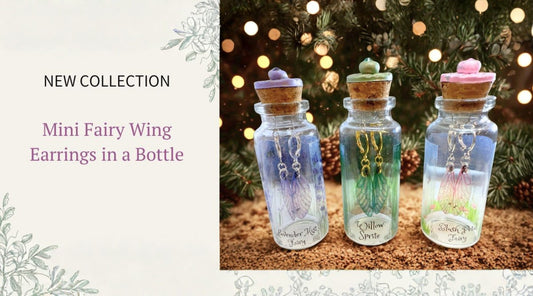 Three mini apothecary bottles with faerie wing earrings inside