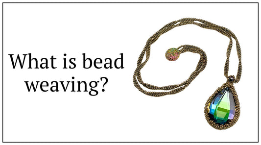 a large multicolored teadrop crystal necklace with gold seed bead chain