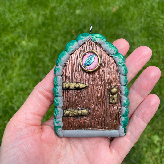 leaf elven fairy ornament held in a hand.