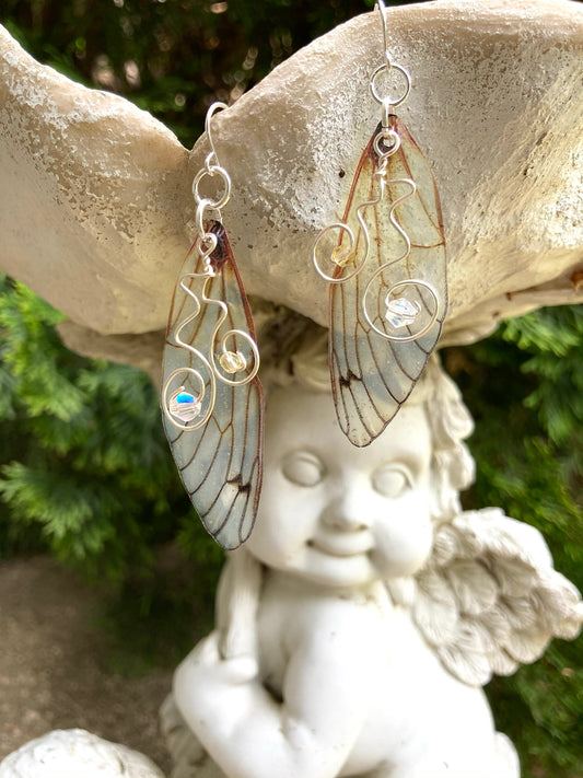 Yellow butterfly wing earrings with silver color wire swirls and crystals with sterling silver ear wires.