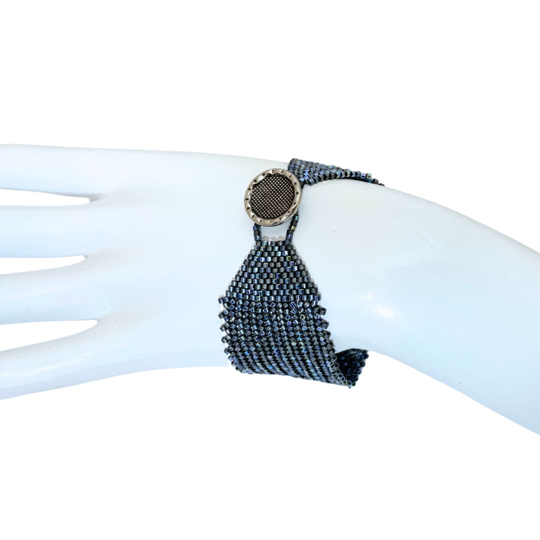 herringbone seed bead bracelet on  model showing button fastner