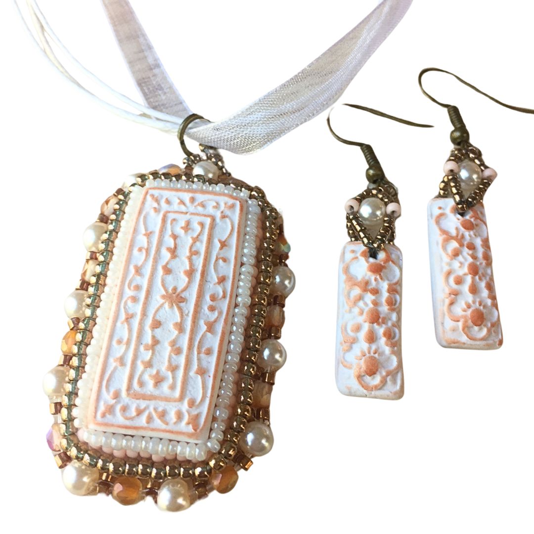 copper and white floral beaded necklace jewelry set against a white background.