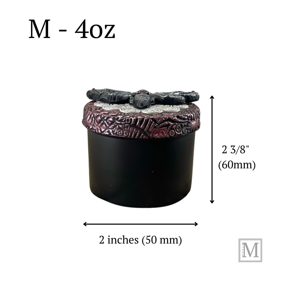 Photo showing measurements of 4oz black aluminum storage tin with handcrafted polymer clay purple textured lid with lace detail. with a hawkmoth with red crystal on abdomen.