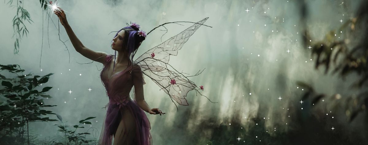 Fairy reaching for a magical light in a fantasy forest