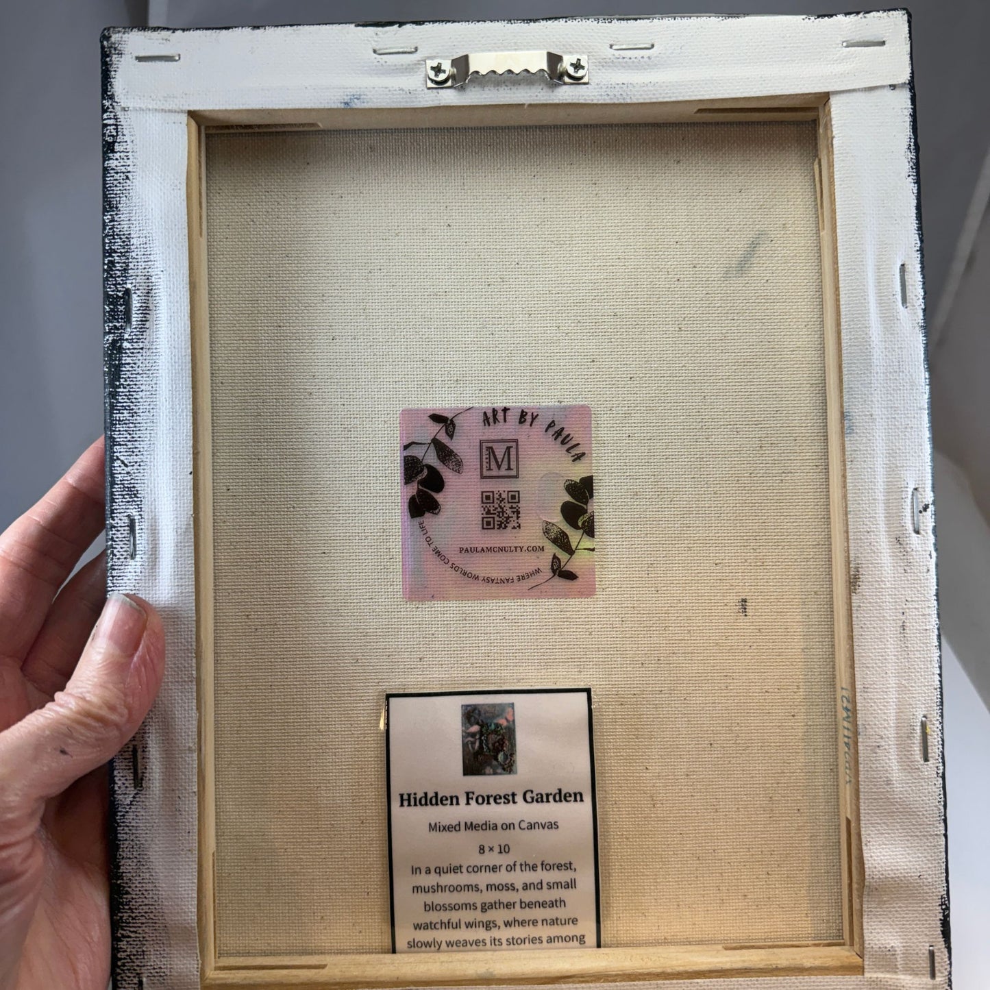 Framed artwork with a label inside the frame