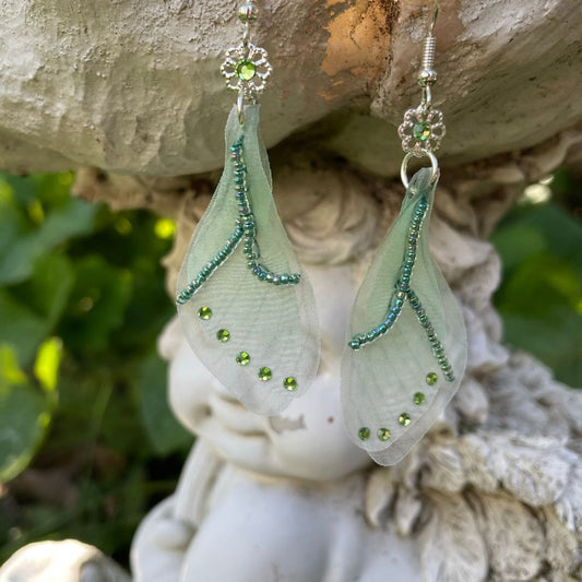 Green sheer fabric beaded butterfly wing earrings with green crystals with a flower bead connecting to the ear wires.