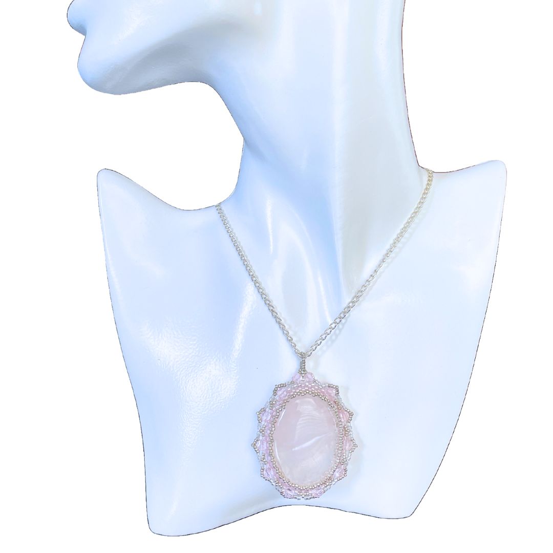 rose quartz beaded necklace on a model against a white background.