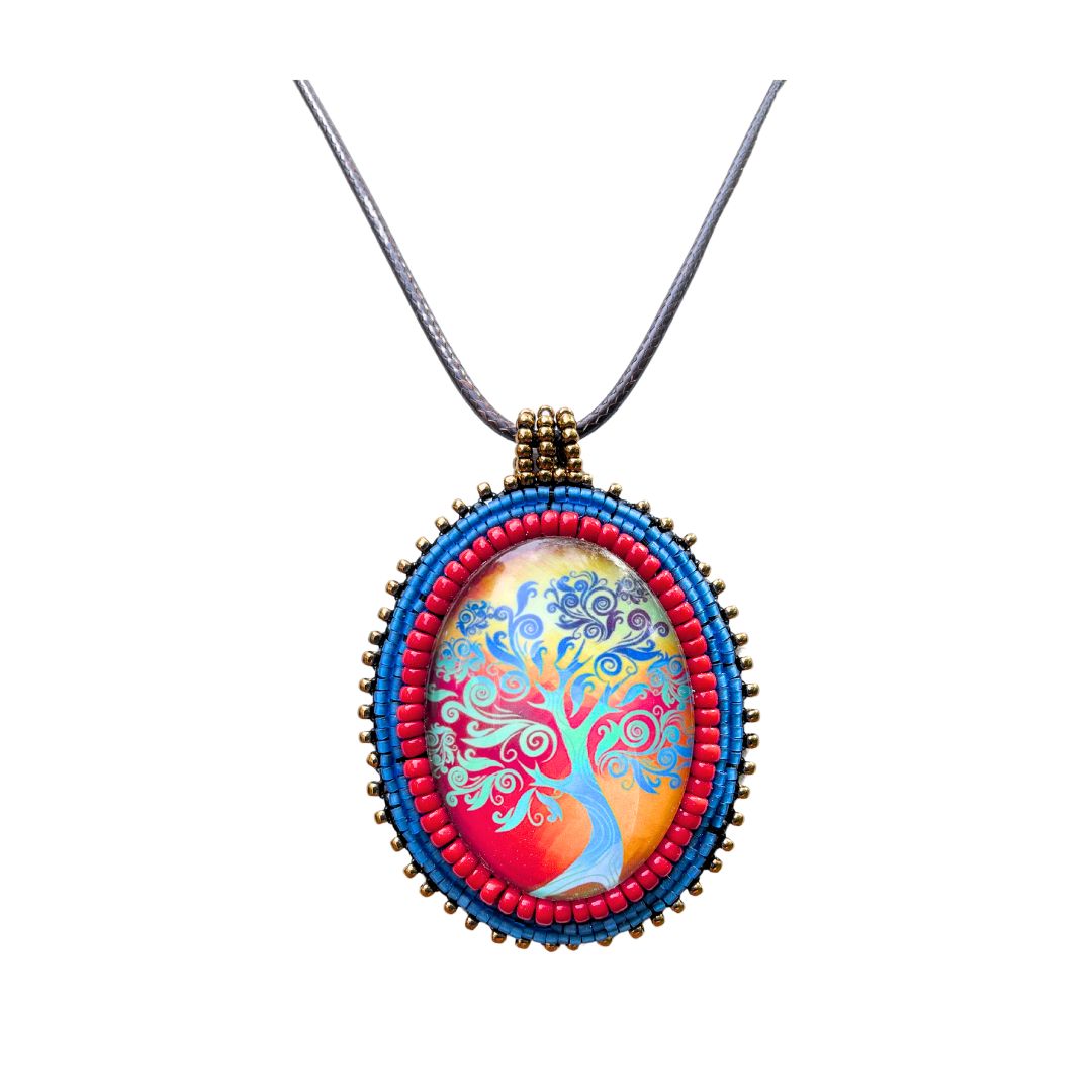 Ovsl pendant with swirly whimsical blue tree with gold and red sunset with blue, red and black glass seebead edging