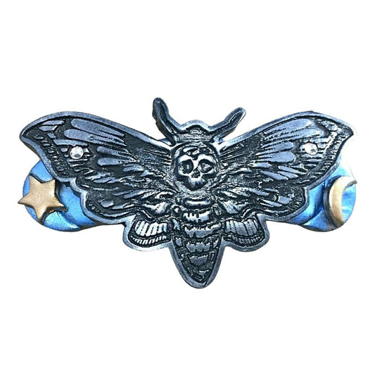 Death's Head Moth Hair Clip with blue base and gold moon and star detail.
