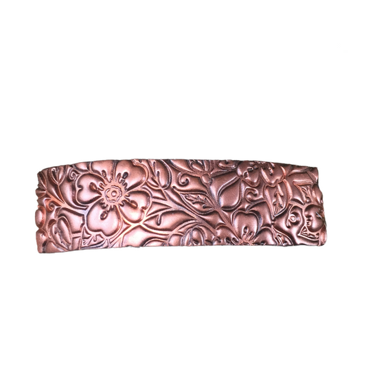 Metallic copper colored, textured flower hair barrette.