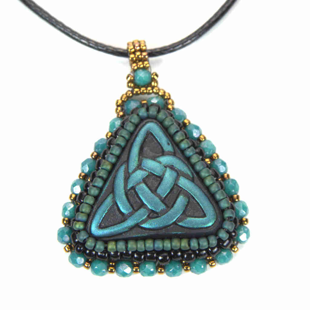 Blue celtic trinity knot pendant with green beading turquoise green crystals and gold beaded bail on a black cord chain