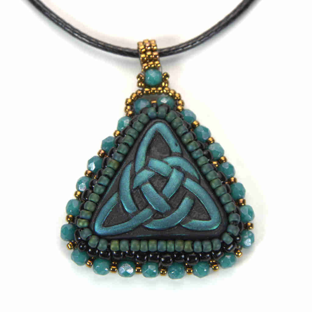 Blue celtic trinity knot pendant with green beading turquoise green crystals and gold beaded bail on a black cord chain