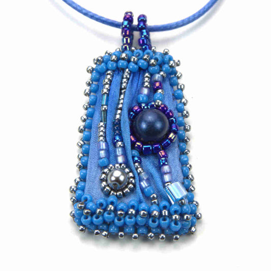 Front view of blue shibori silk beaded pendant