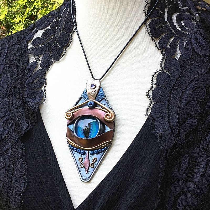 Handmade large polymer clay blue glass eye dragon necklace