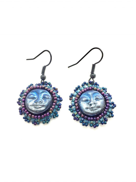 Blue moon face earrings with purple and blue seed beaded edging.