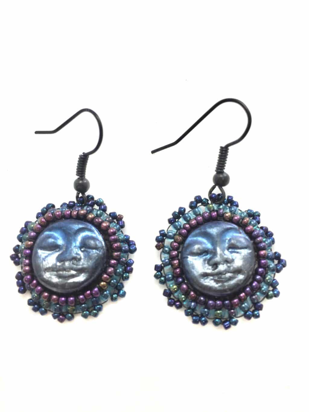 Blue moon face earrings with purple and blue seed beaded edging.