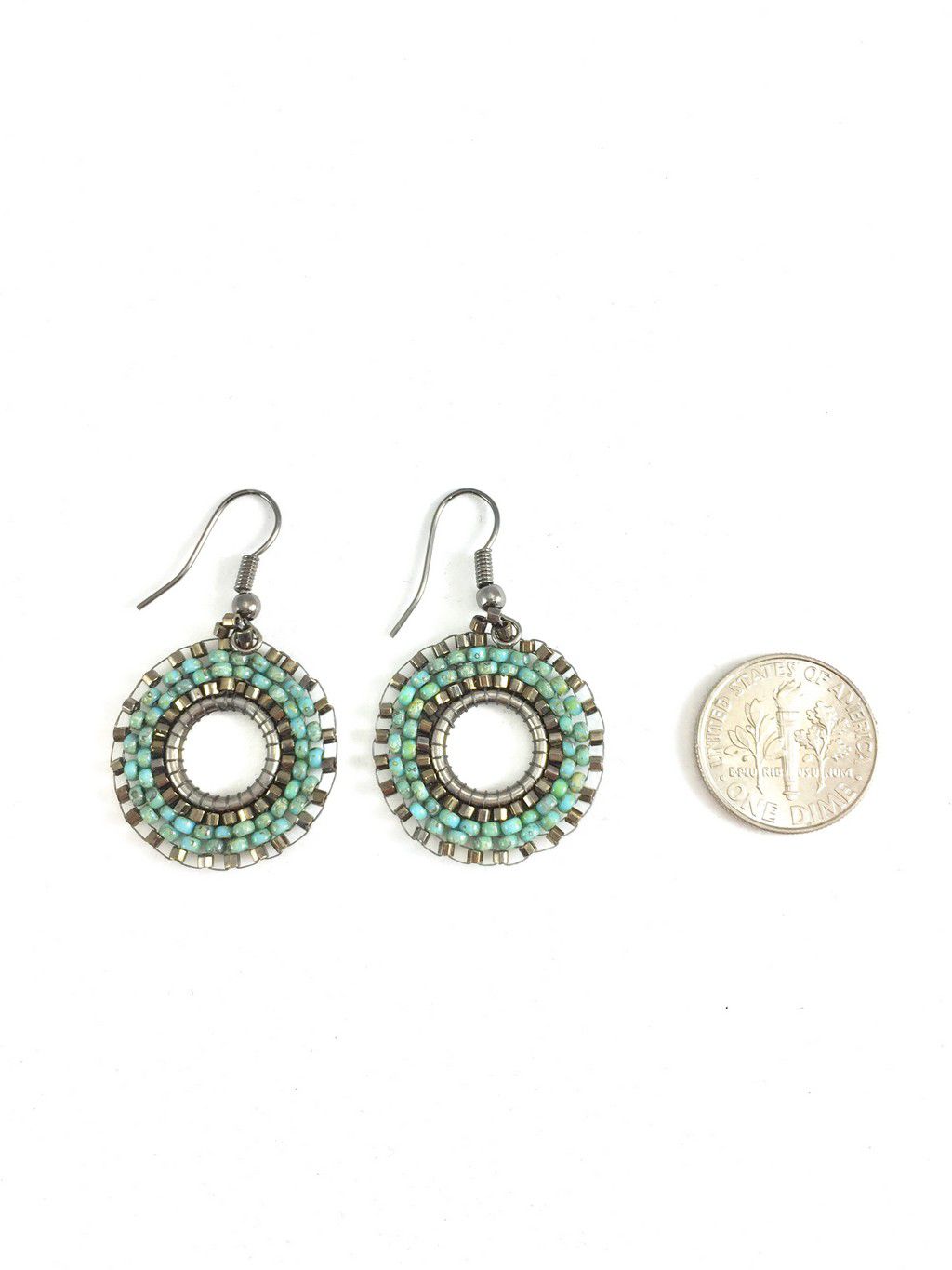 turquoise boho hoops with quarter coin for size reference.