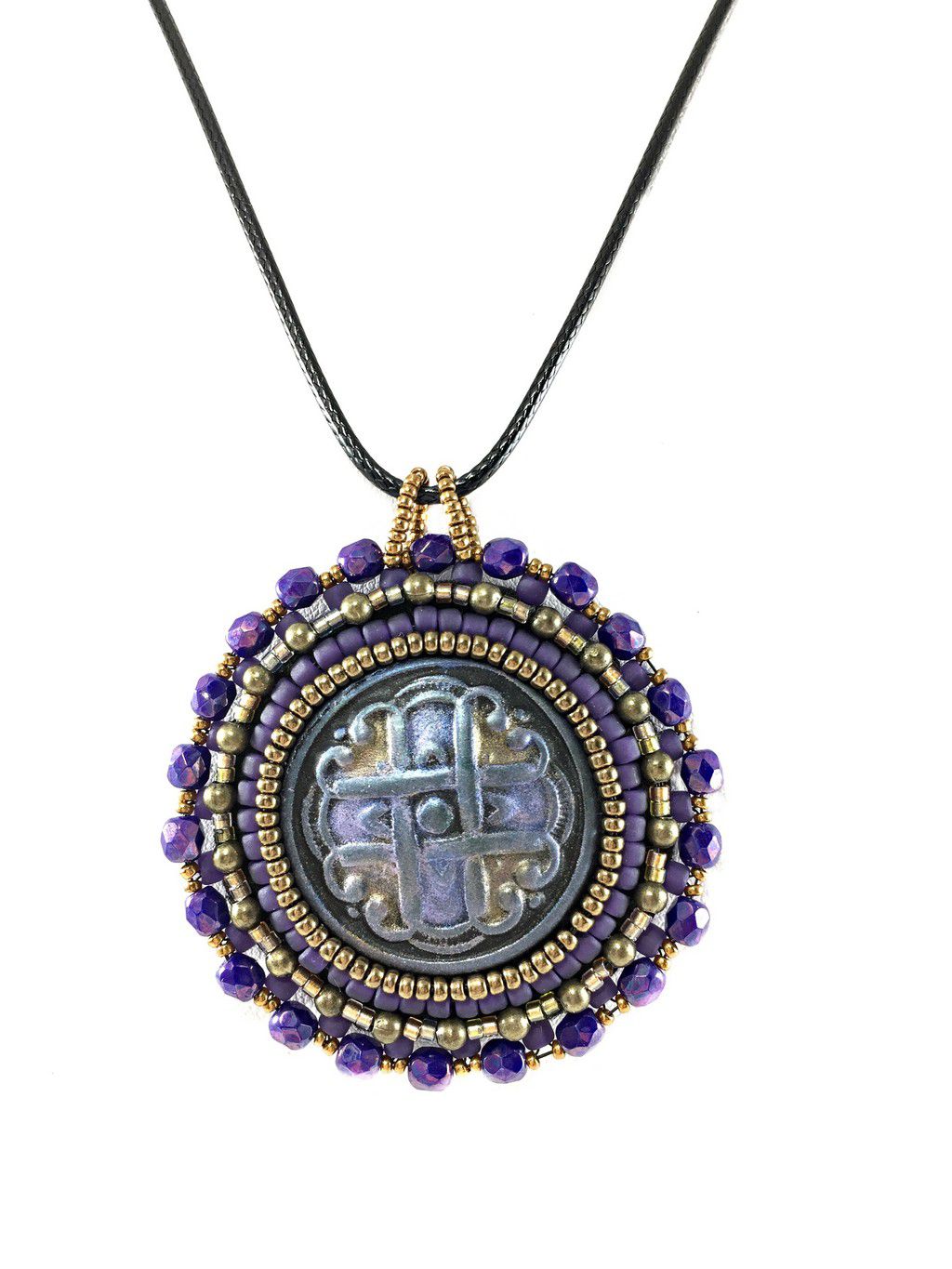 A purple Celtic love knot motif, surrounded by purple and gold seed bead edging and purple crystals. Pendant is on a black cord chain.