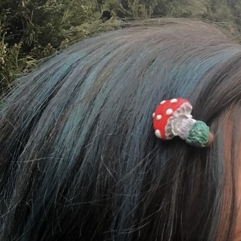 Small red mushroom hair on model