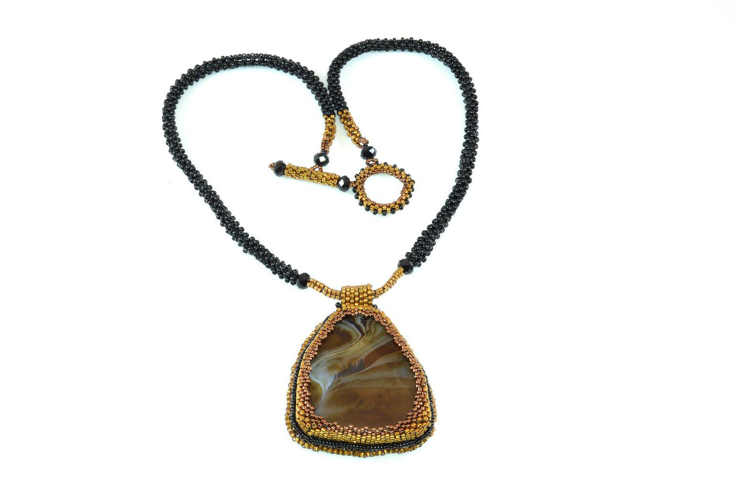 Large Brown Agate gemstone necklace with gold seed bead edging with gold and black seed bead chain & beaded toggle clasp.