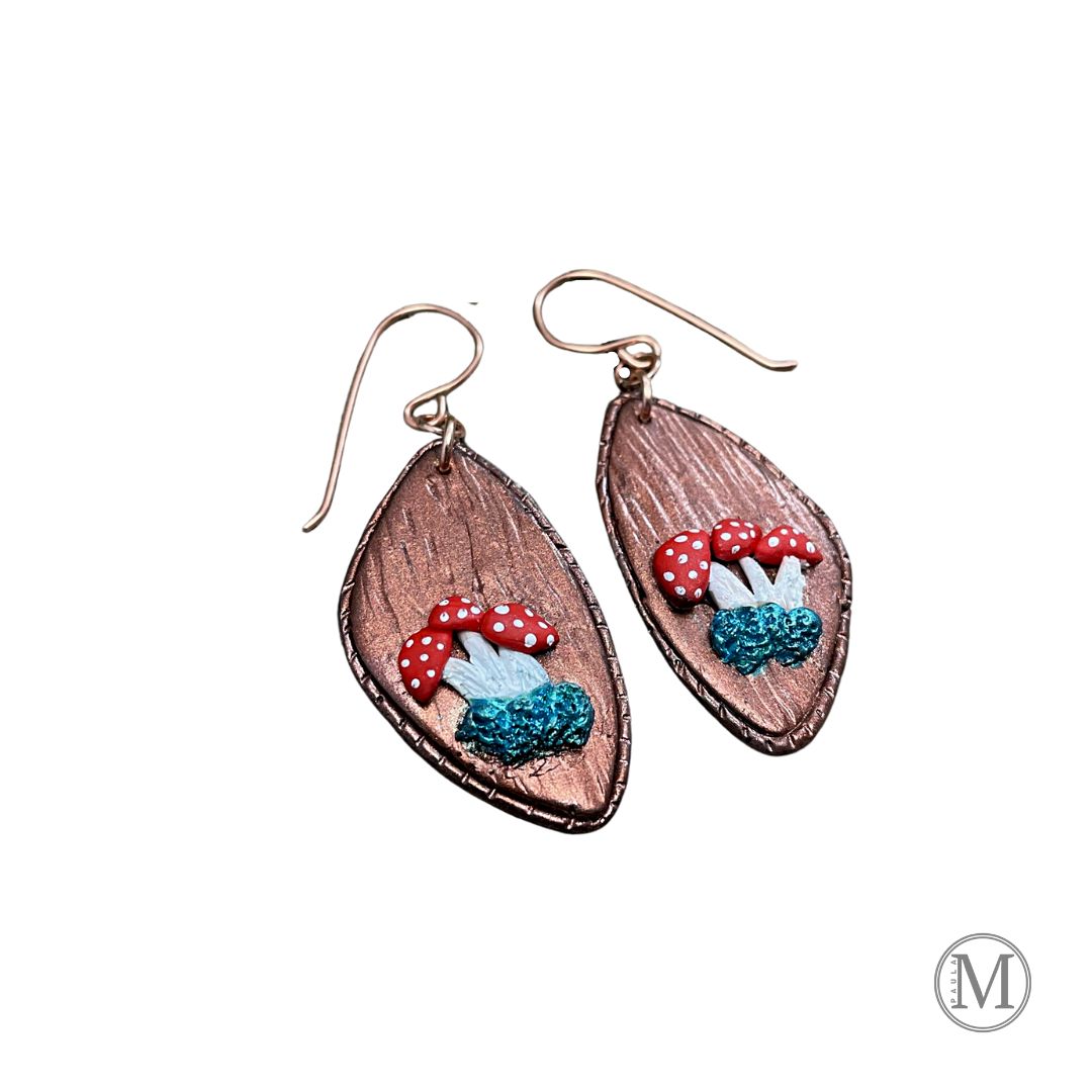 Geometric shaped bronze clay dangle earrings with small clusters of Amanita mushrooms