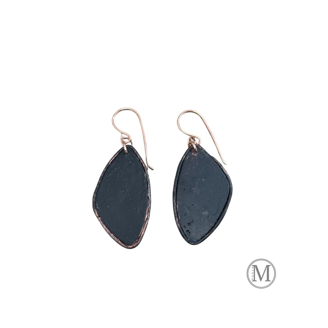 Back of Geometric shaped bronze clay dangle earrings with small clusters of Amanita mushrooms