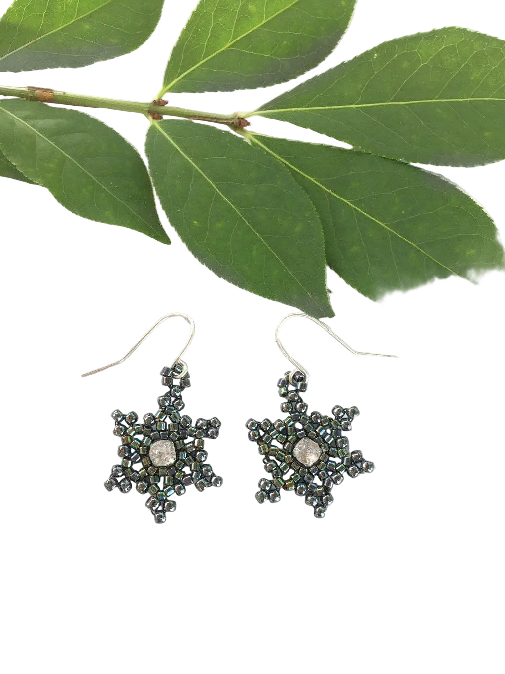 Black gothic snowflake earrings close up view