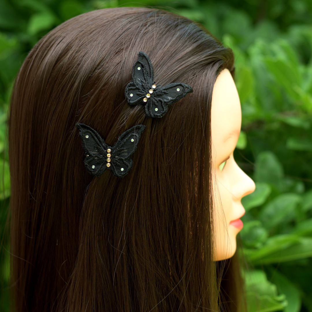 Side profile of model wearing black applique butterfly alligator hair clips with your choice of crystals