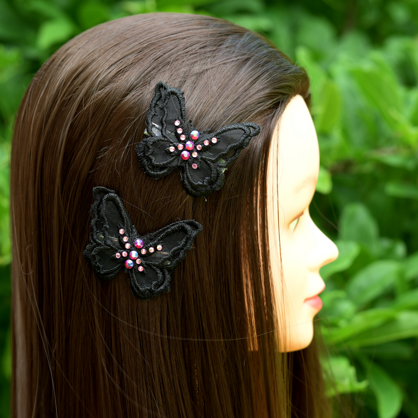 Side profile of model wearing black applique butterfly alligator hair clips with your choice of crystals