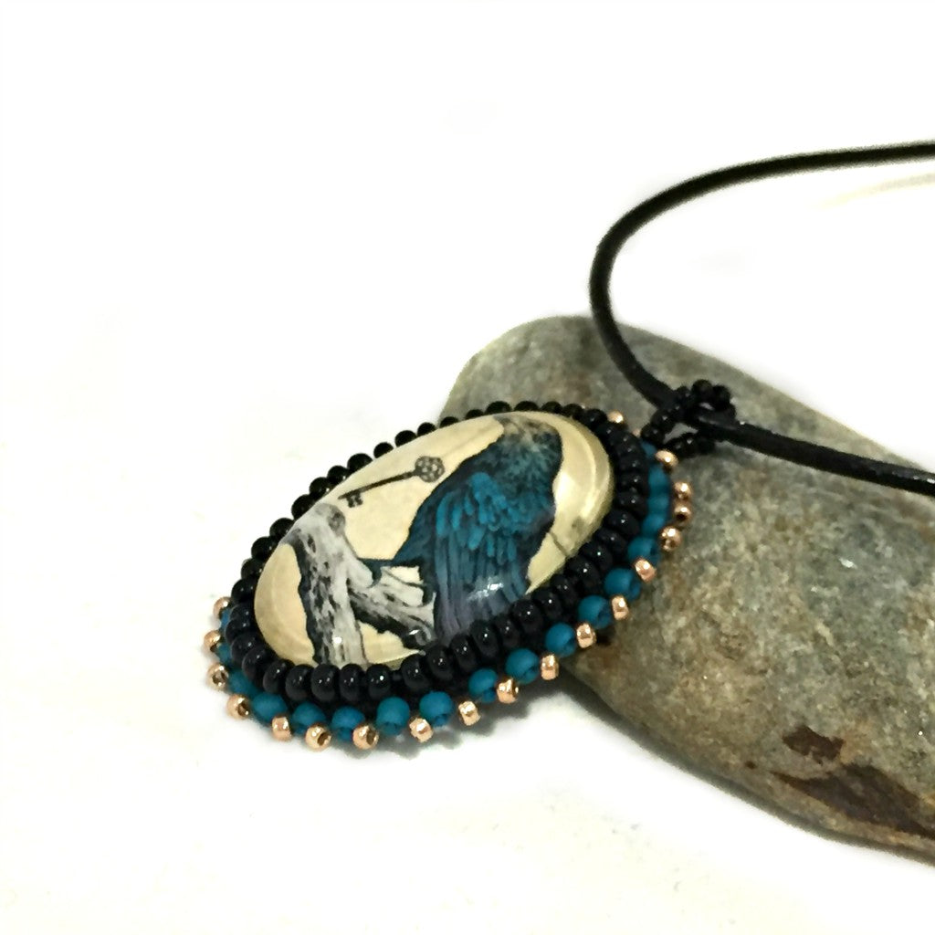 blue raven pendant left side