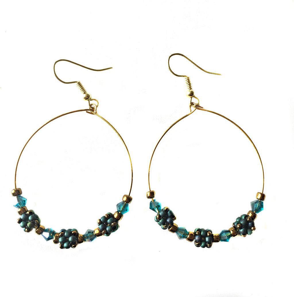 2 inch gold wire hoop earrings with blue cubic hand-stitched beads, blue crystals and gold beads.