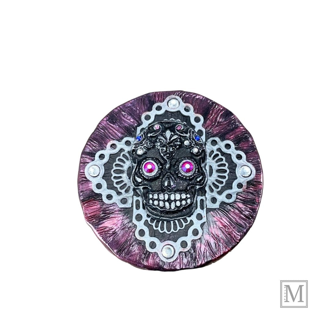 Black and Silver Sugar Skull with pink luster crystal eyes and colred small crystal details on a clay lace cross overlay with a deep metallic clay covered lid.