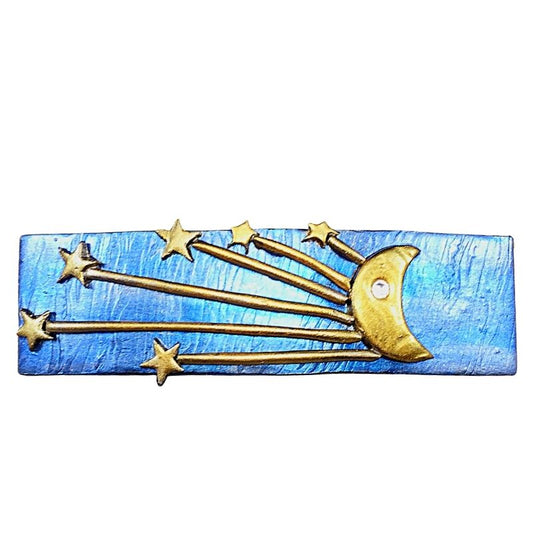 Blue hair barrette with gold crescent moon and starburst.