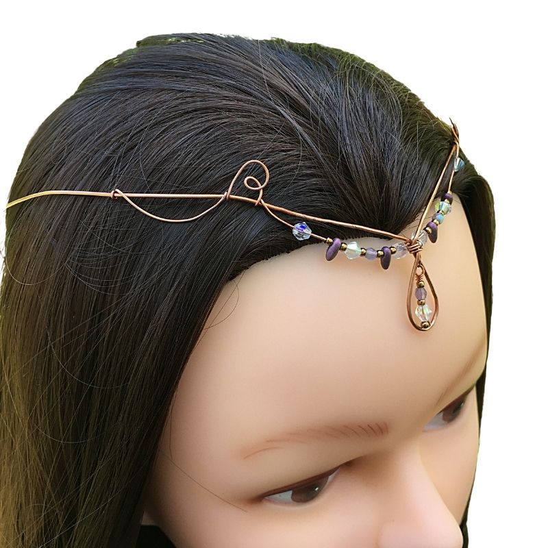 Model wearing teardrop crystal forehead tiara copper crystal diadem.
