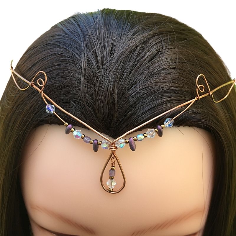 Model wearing teardrop crystal forehead tiara copper crystal diadem.