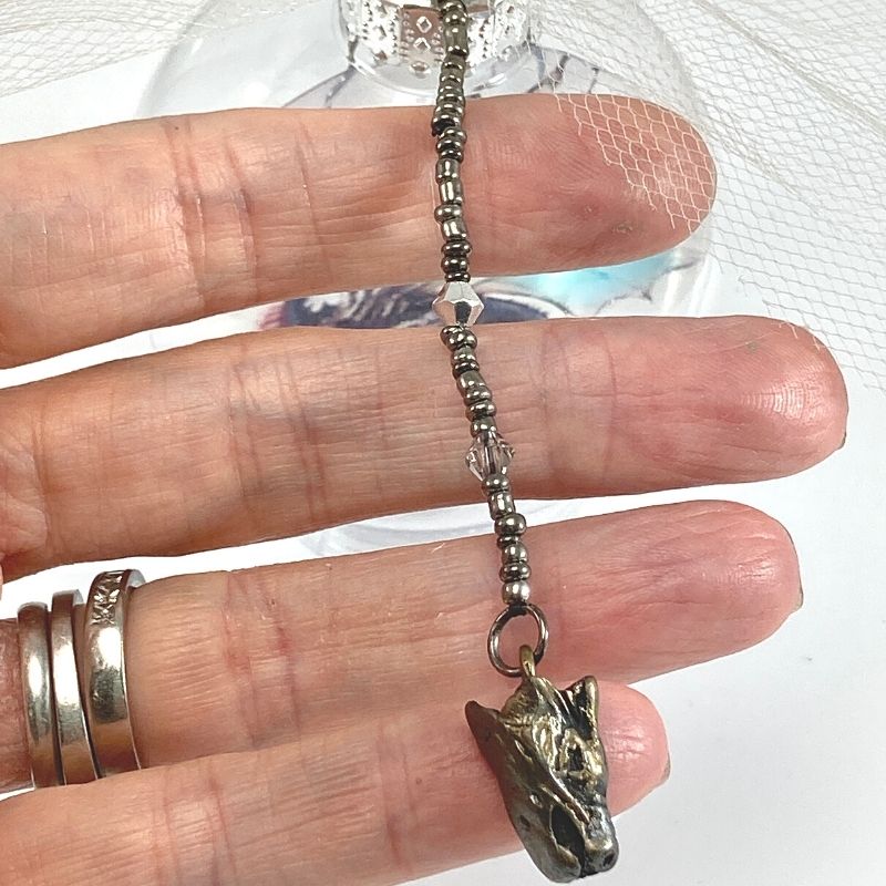 dragon head charm on beaded strand