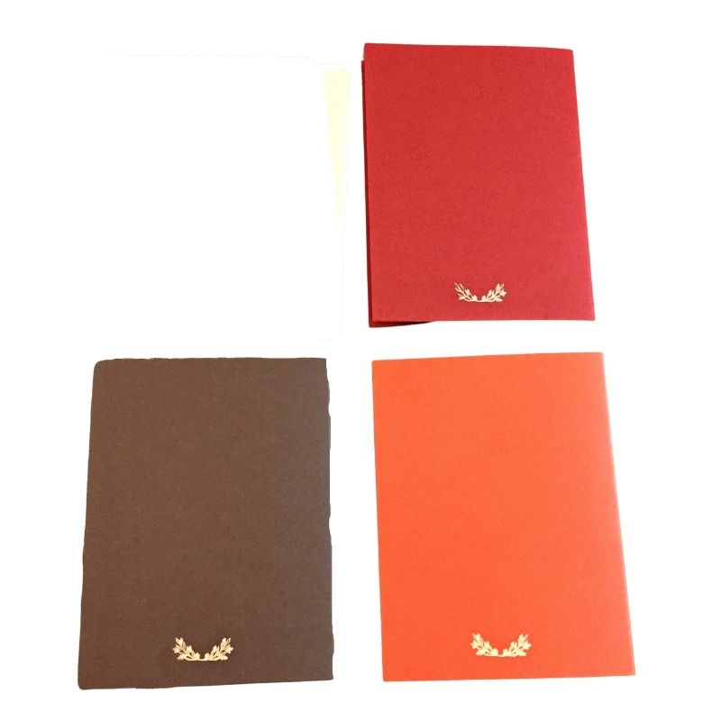 Back of 3 Gold ink drawn dragon blank notecards in red, brown and orange.