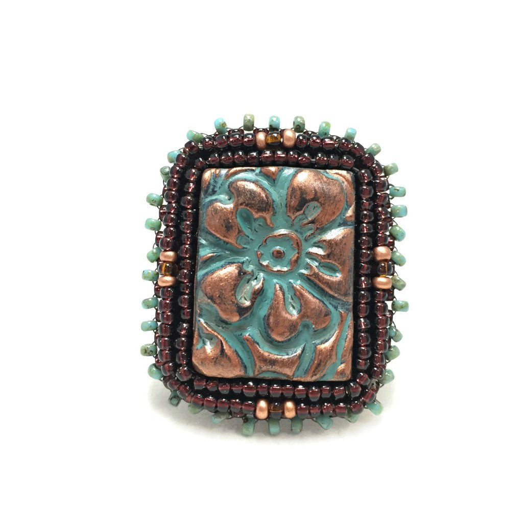 front of textured patina copper and turquoise beaded flower ring