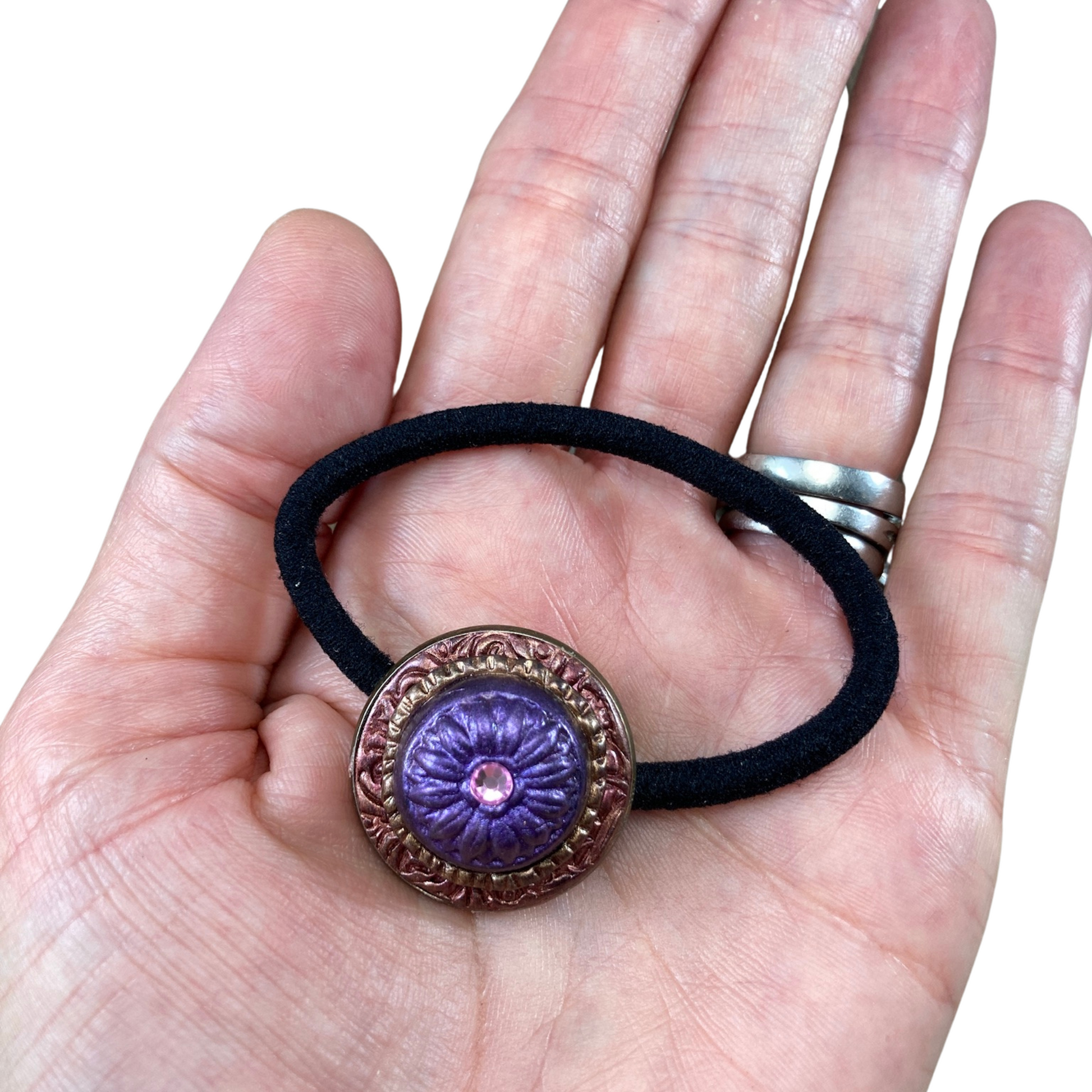 polymer clay purple daisy with crystal hair tie in hand