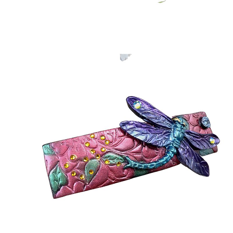 Dragonfly polymer clay hair barrette with pink base and purple and green dragonfly.