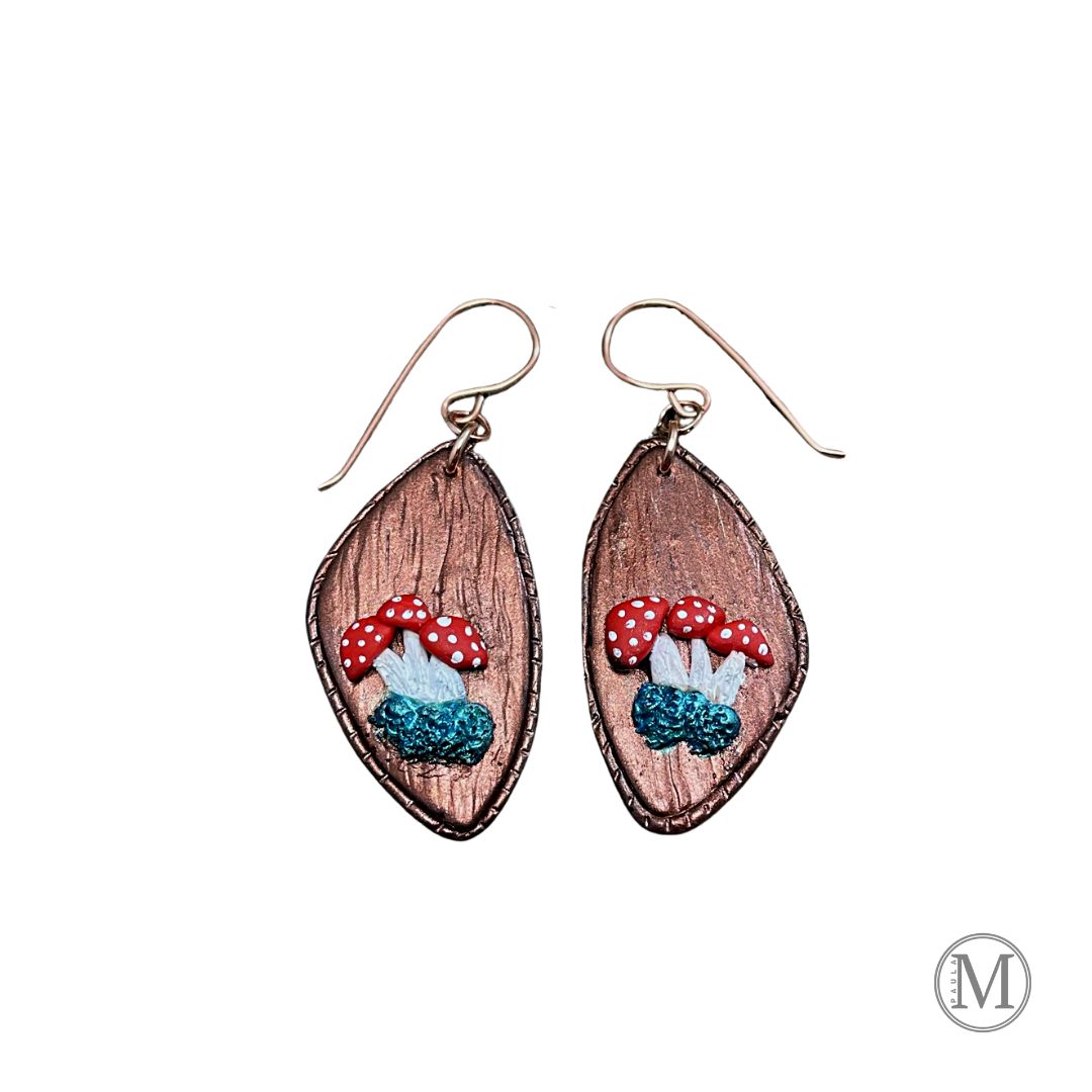 Geometric shaped bronze clay dangle earrings with small clusters of Amanita mushrooms