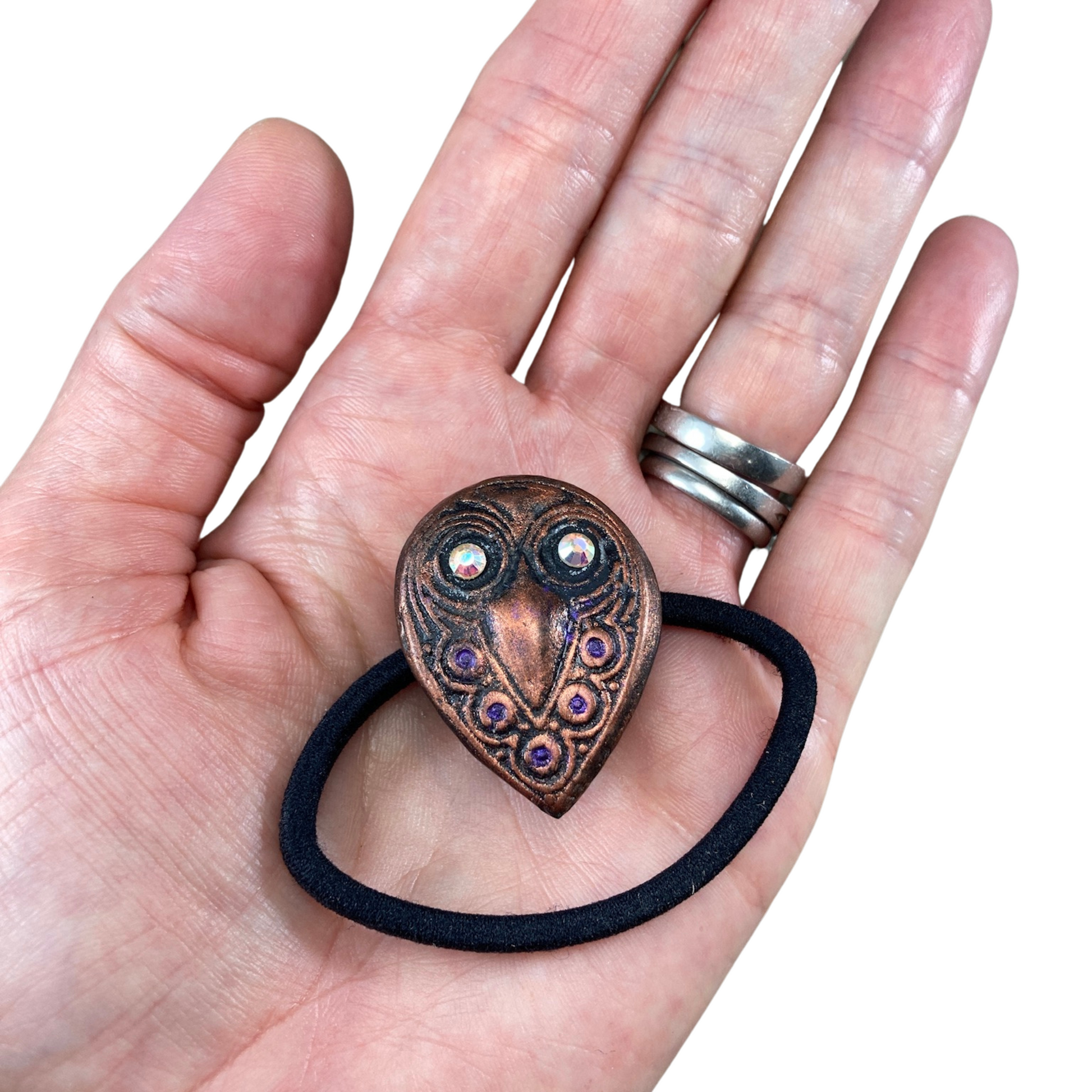 polymer clay copper painted owl with crystal eyes hair elastic on hand
