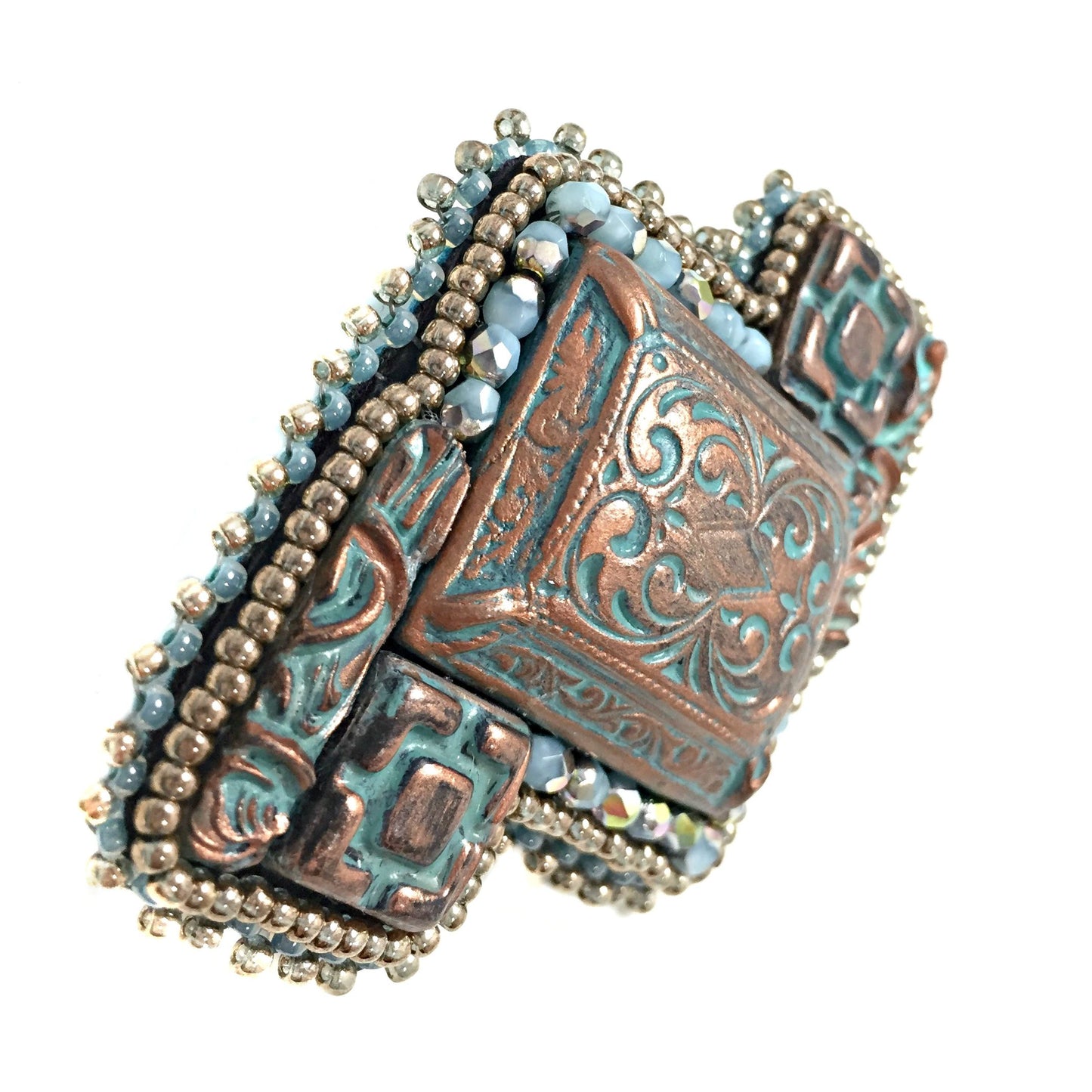 side view of copper patina brooch