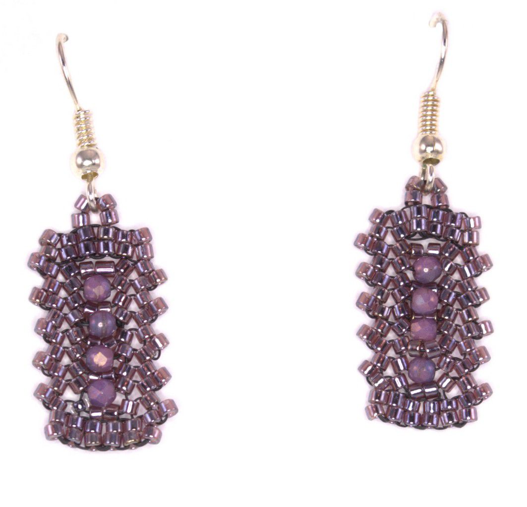 Small pink crystal seed bead bar earrings with pink crystals in the center in a vertical row.