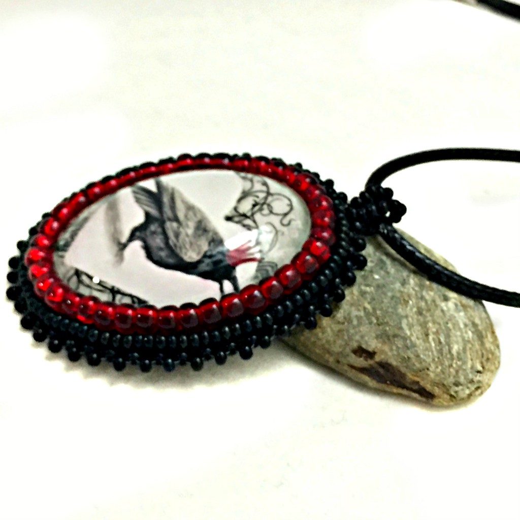 red crown raven pendant left side