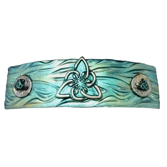 3 triquetras on a green and gold hair barrette.