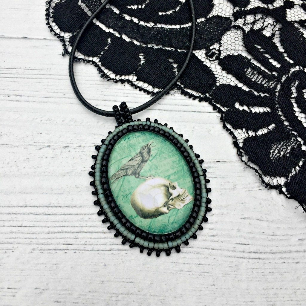 Turquoise raven skull pendant