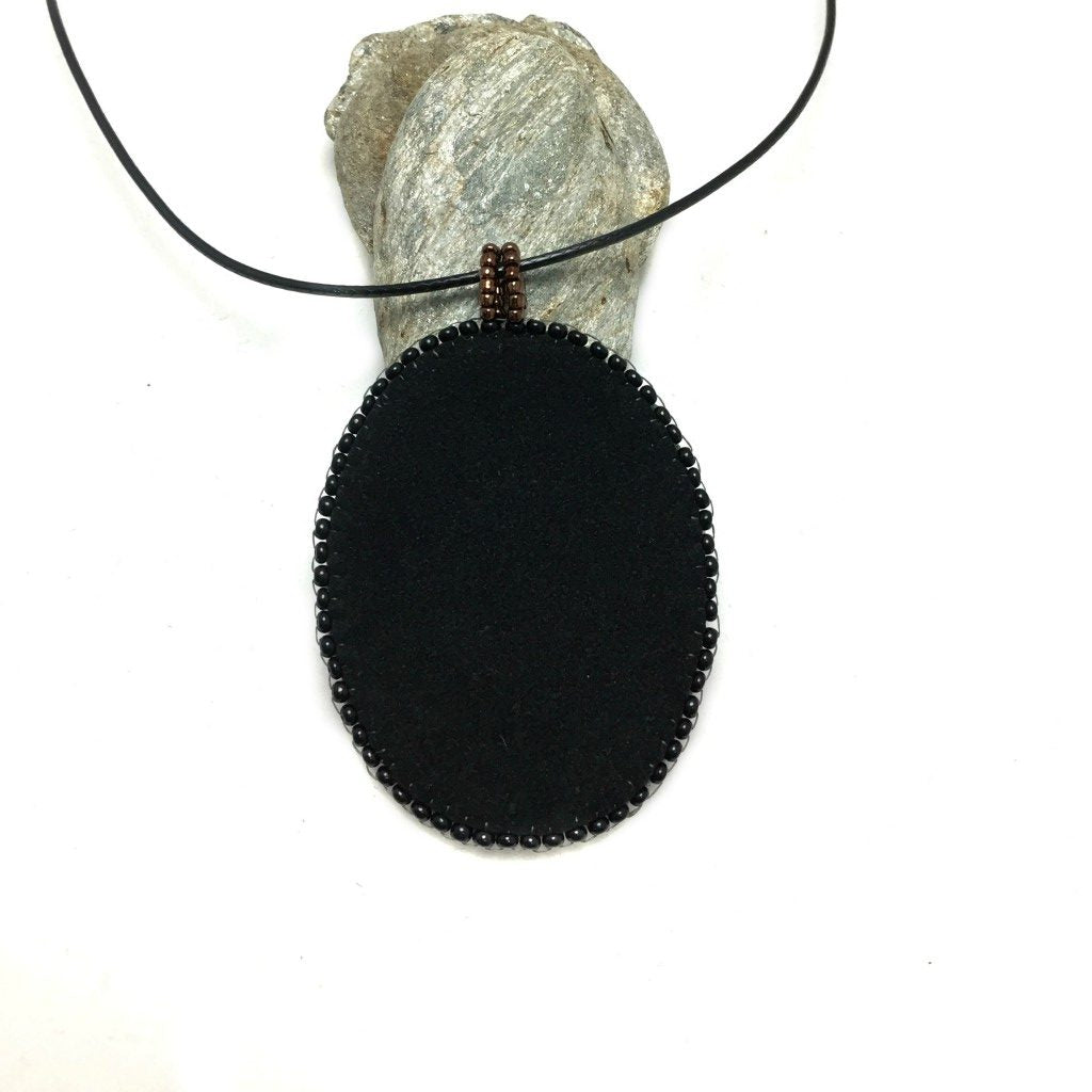 zentangle art pendant with blue crystals left side