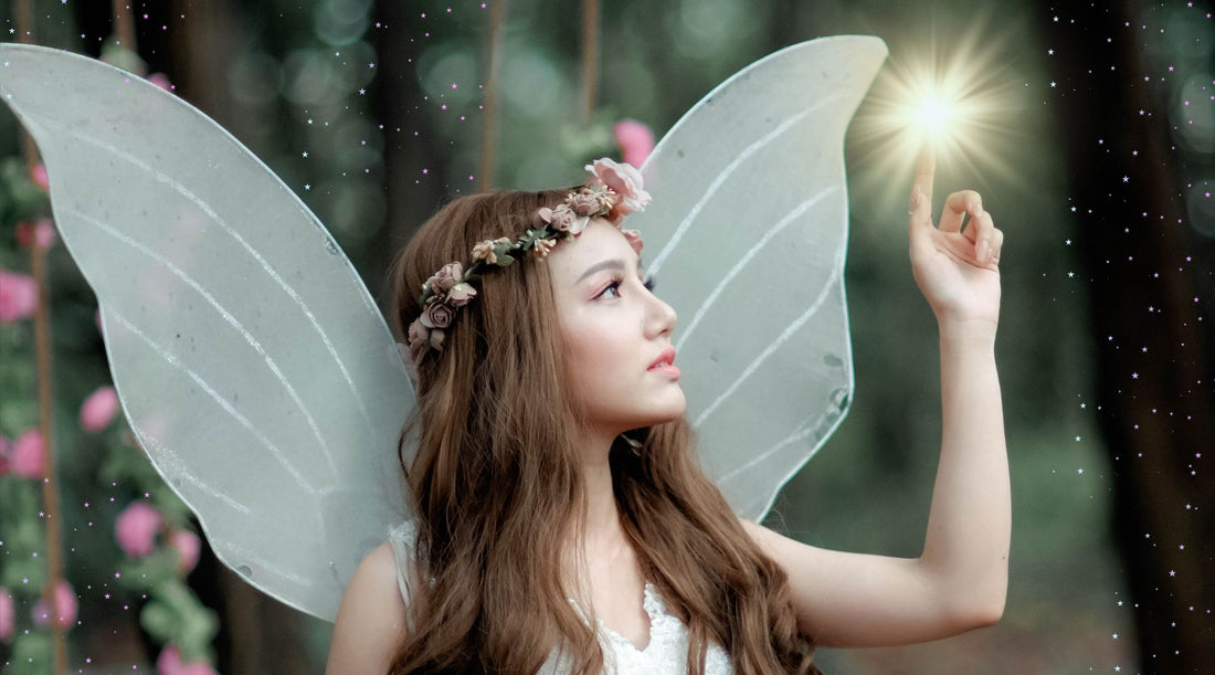 A close up of a fairy in a magical forest touching a ball of light